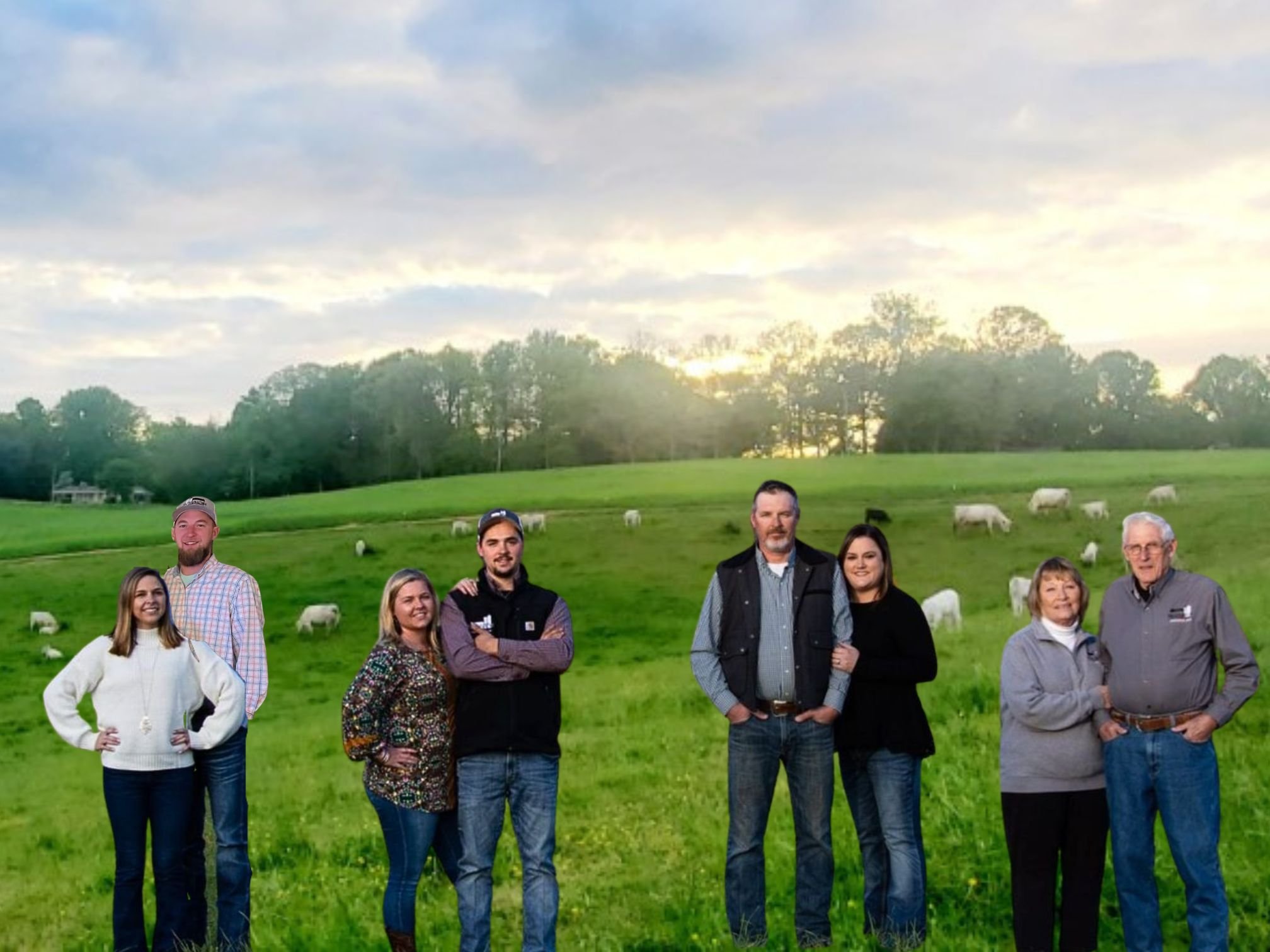 Group of six people standing on a green farm with grazing cattle, under a cloudy sky at sunset. The scene captures a sense of community and rural life, highlighting family ties in agriculture.